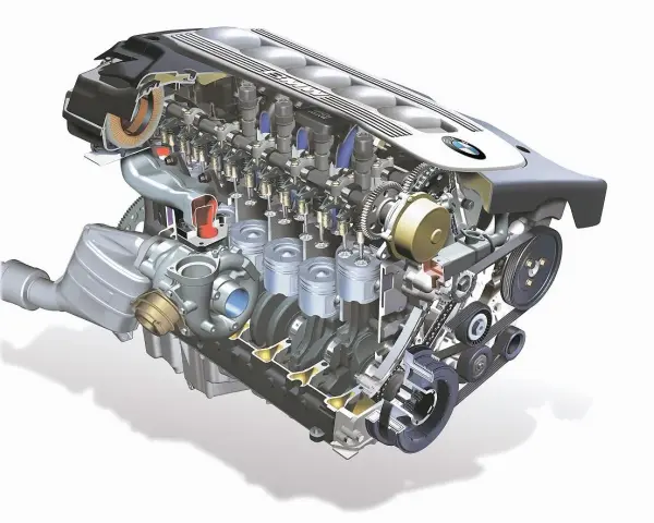 Przekrój silnika m57 z turbosprężarką, tłokami i wałkami rozrządu. Widoczne detale mechaniczne.